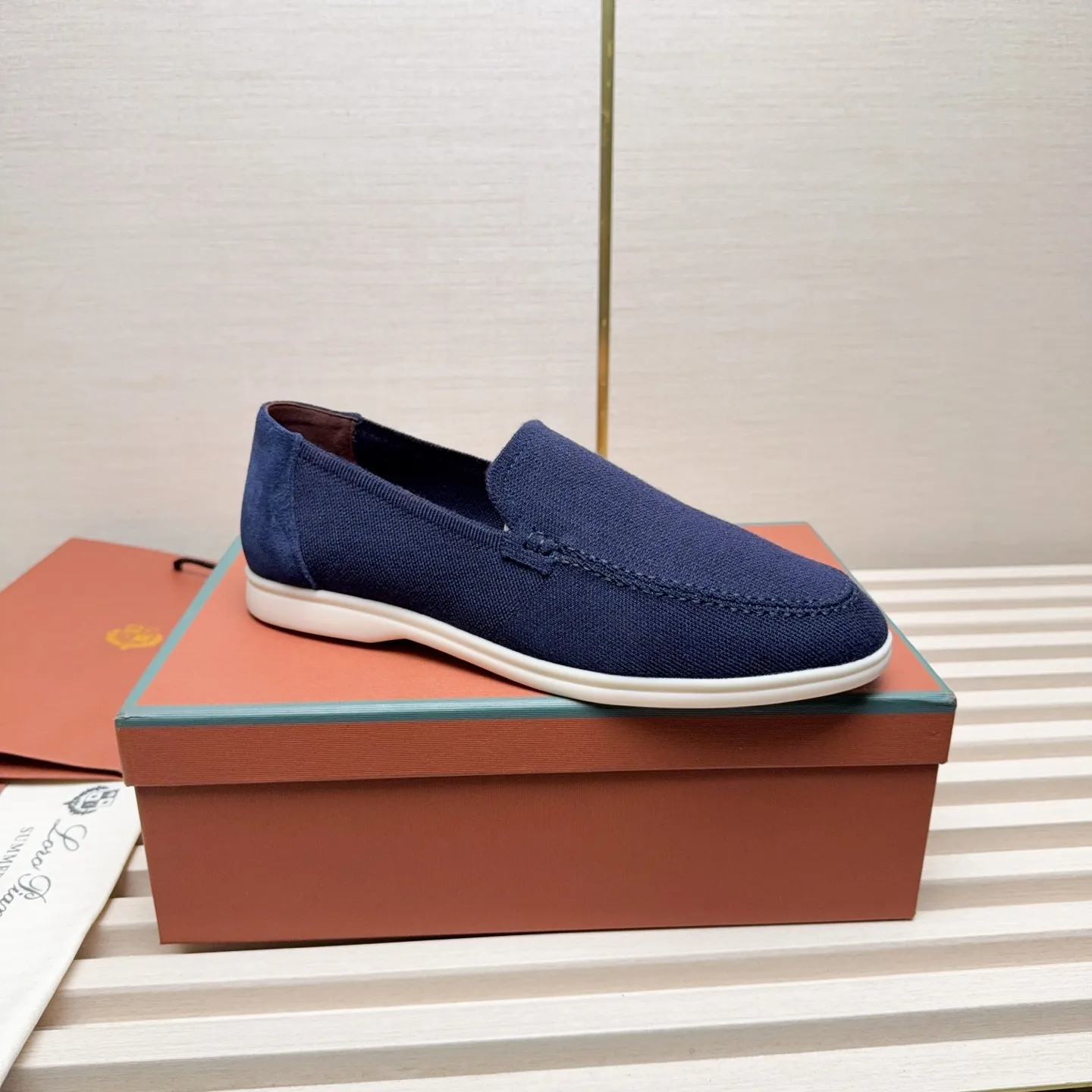 Men's Men's Shoes 💰400 Loro PIana moccasins are made of wish wool fabric. The upper is made of knitted fabric, made on a loom, and then attached to a rubber sole. The Rain System's water-repellent treatment enhances the shoe's functional design, while the suede details give the shoe a sense of elegance and sophistication. Made from Wish, fine wool from Australian and New Zealand Merino sheep
